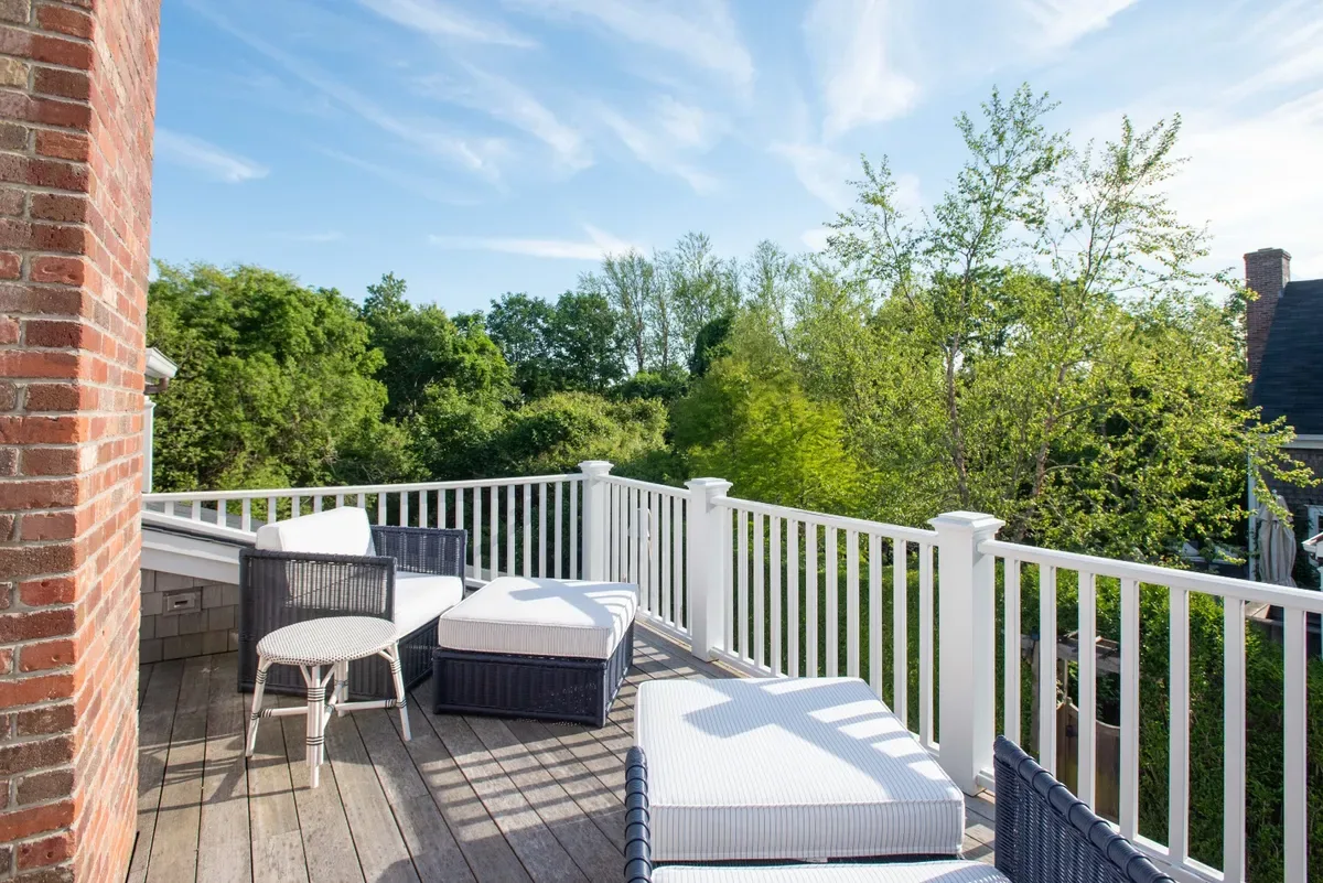 West-facing balcony off the master suite looking out into the treetops