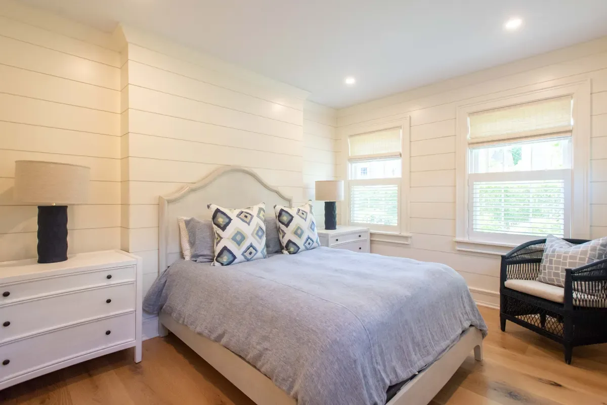 First-floor bedroom suite with shiplap walls