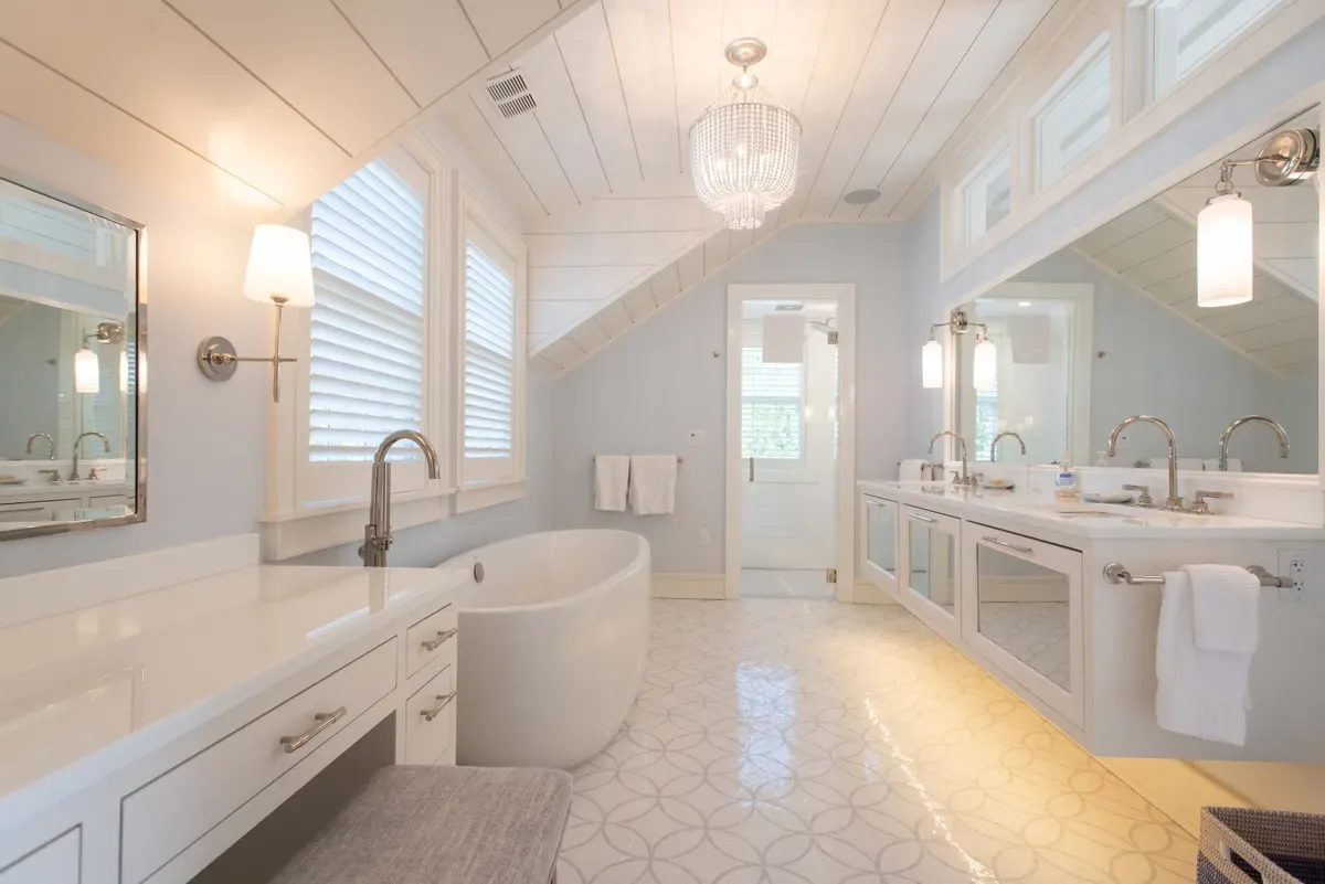 Master bath with a freestanding oval soaking tub and floating double vanity